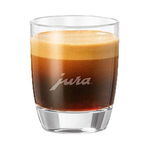 JURA espresso glas met donkerbruine espresso en crèmalaag, transparant glas op witte achtergrond | Arte dell' espressO