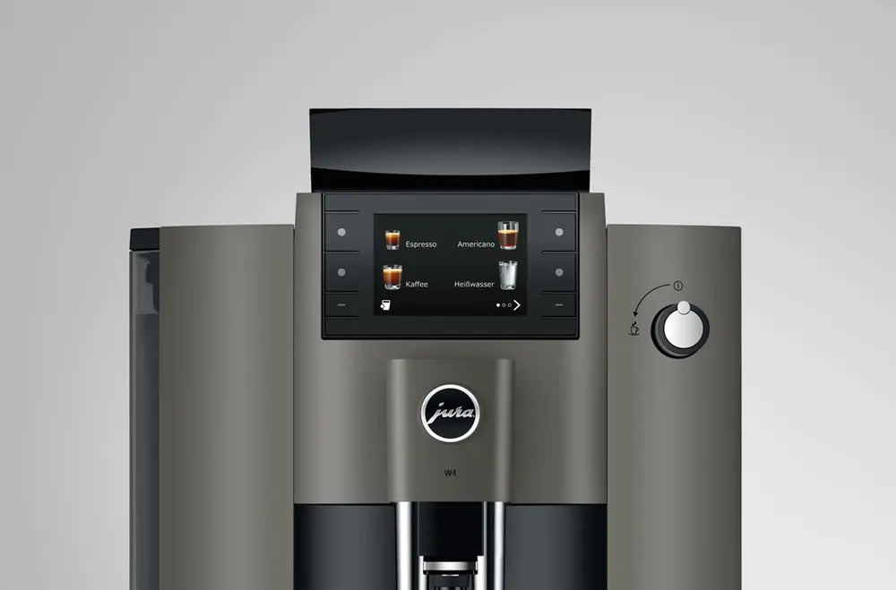 JURA W4 Dark Inox koffiemachine met touchscreen en draaiknop in zakelijke omgeving