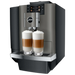 JURA X10 Dark Inox zakelijke koffiemachine met twee glazen latte macchiato op het dienblad