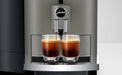 JURA X4 Dark Inox zakelijke koffiemachine met twee glazen espresso onder de uitloop in een moderne keukenomgeving